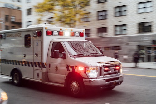 An EMS ambulance driving down a street
