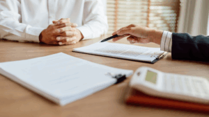 Official looking over claim submission with a medical provider