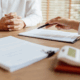 Official looking over claim submission with a medical provider